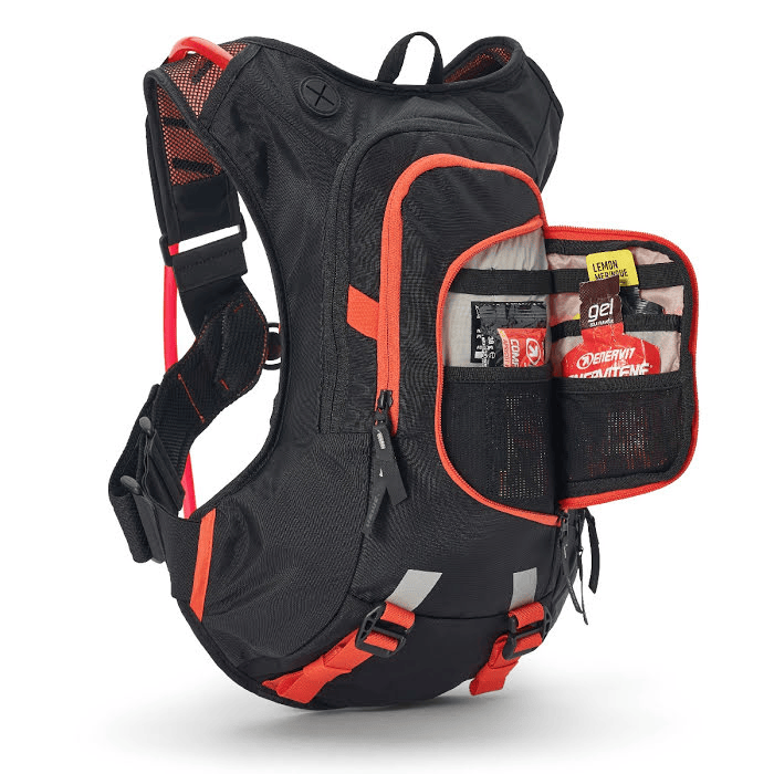 USWE RAW 8L Hydration Pack - open organizer pocket with gear
